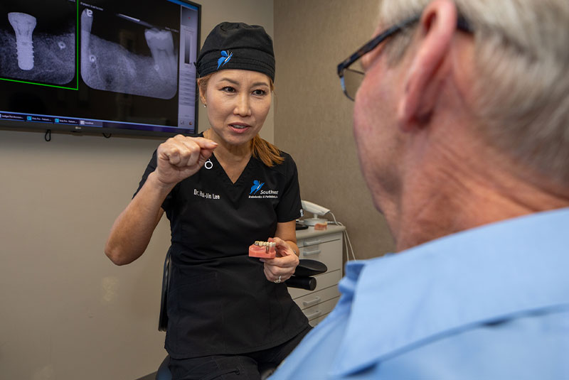 dr lee with full mouth implant patient